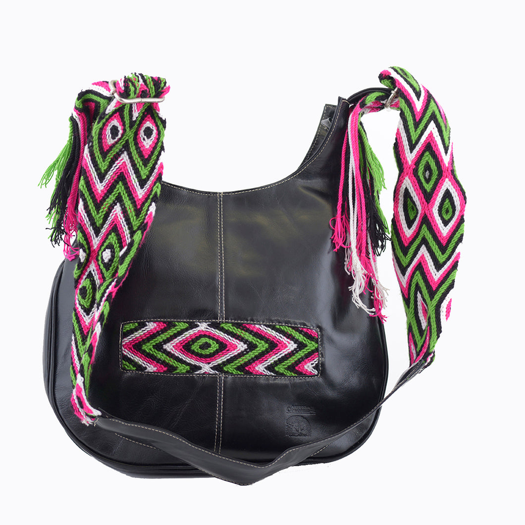 Black leather with pink, green, and white crocheted decoration on a modern Wayuu bag