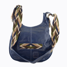 Dark blue leather with tan, blue, green, and brown crocheted decoration on a modern Wayuu bag