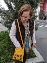 Yellow leather small bag with mola design