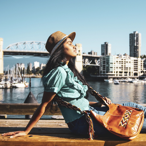 Indian women in Vancouver, Canada with a modern, leather Wayuu bag from IndiArts Collective