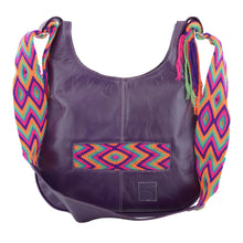 Purple leather with green purple, pink, and orange crocheted decoration on a modern Wayuu bag
