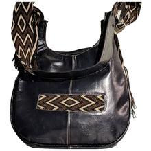 Black leather with brown, tan, and black crocheted decoration on a modern Wayuu bag